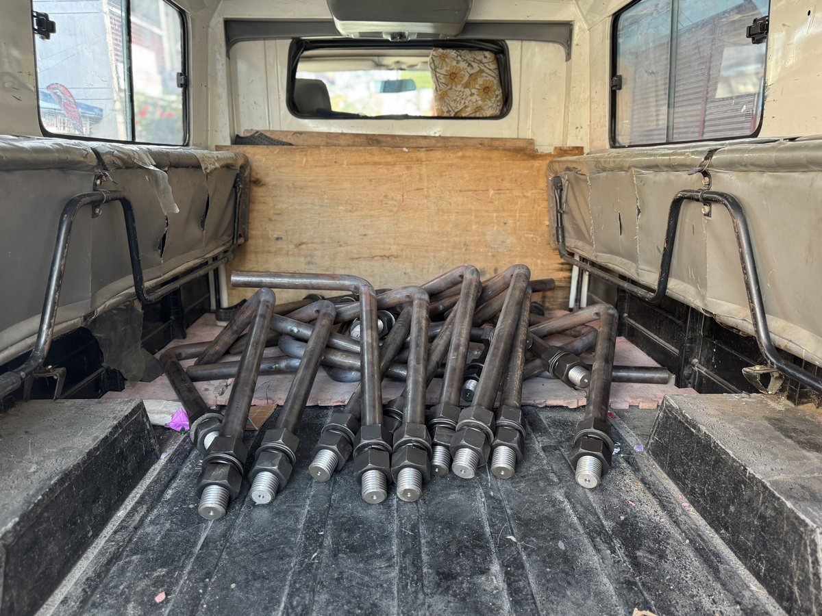 Anchor bolts laid out on the workbench — Southend