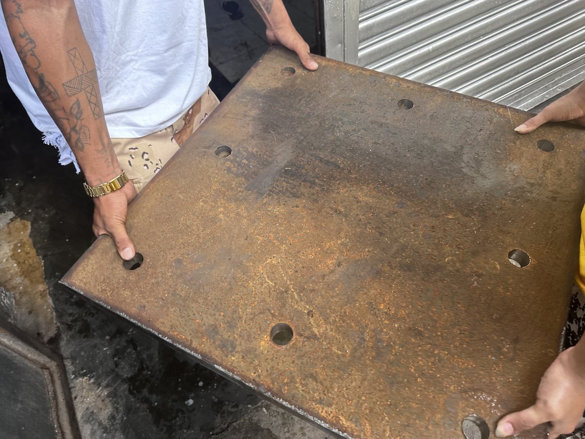 Crew carrying a large fabricated steel base plate — Southend