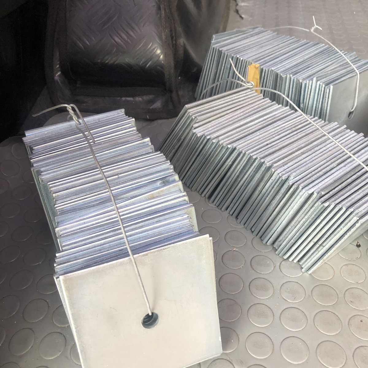Galvanized plates bundled and wired for transport — Southend