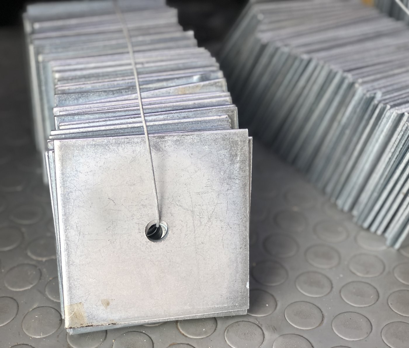 Galvanized steel base plates bundled and wired for delivery — Southend