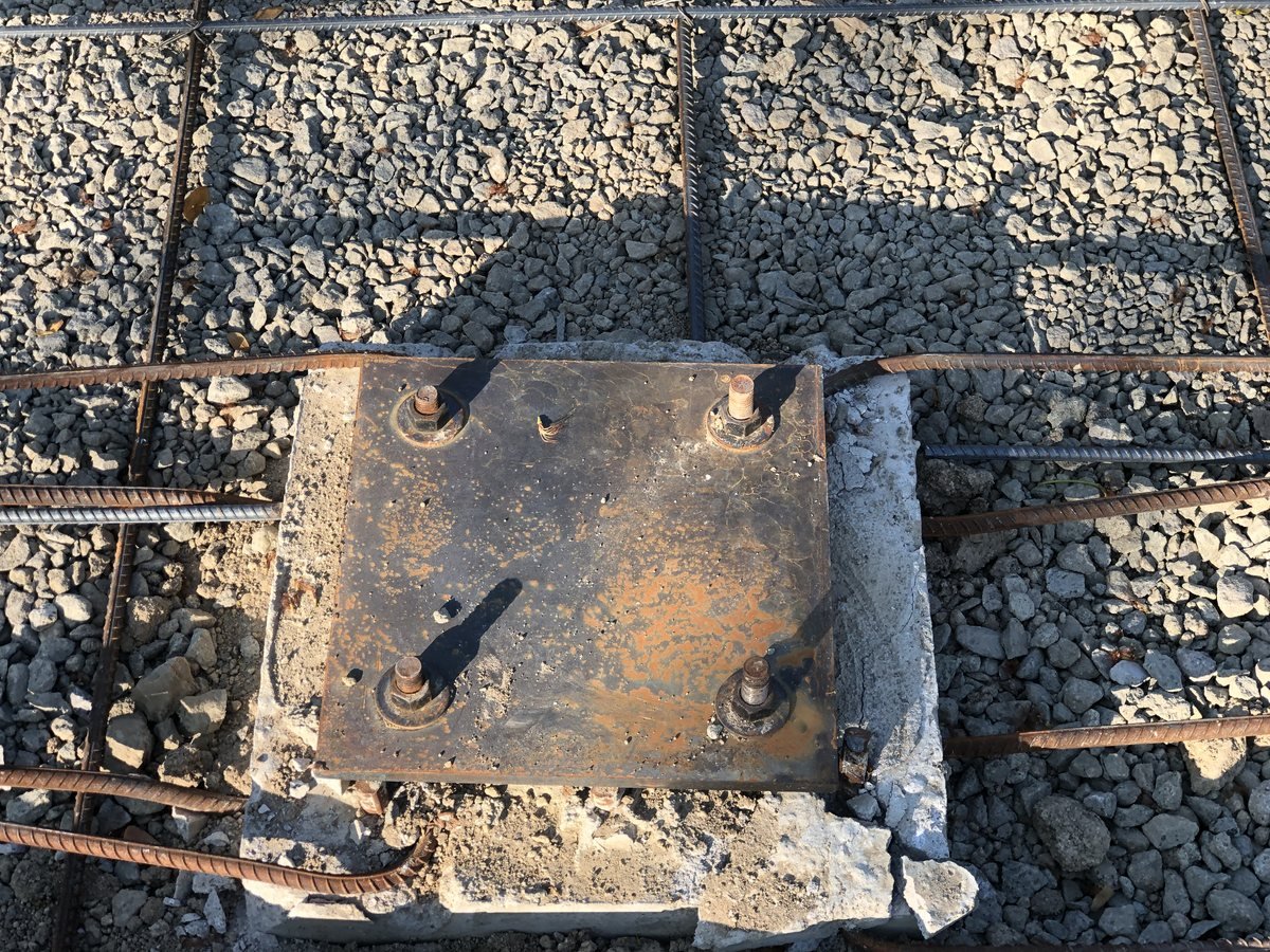 Installed base plate bolted over rebar, top view — Southend