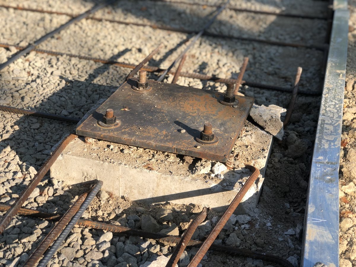 Base plate anchored over rebar foundation, ready for column erection — Southend