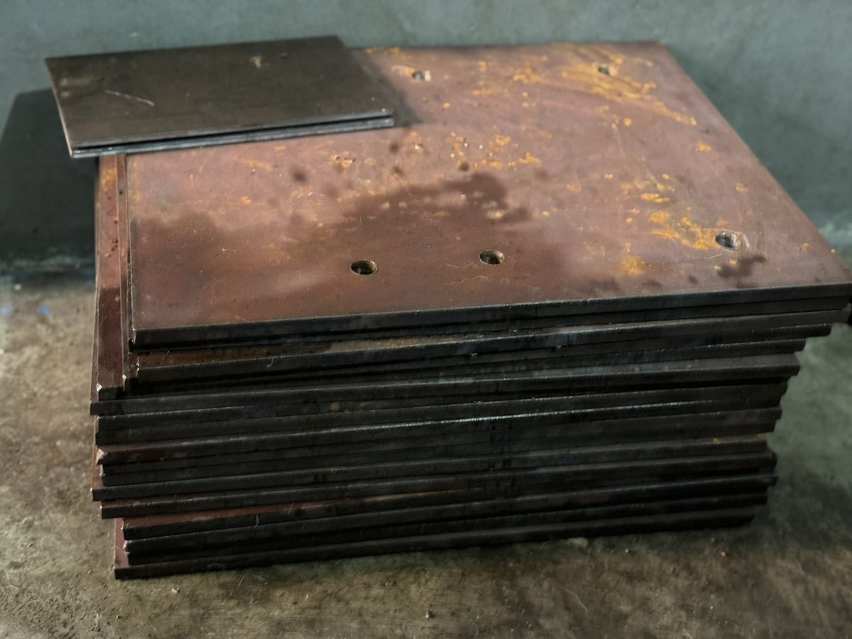 Red-oxide primed base plates stacked for dispatch — Southend